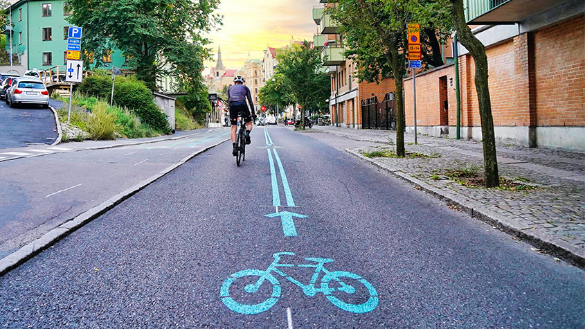 Image of a cyclist travelling on an empty street as a result of lockdown