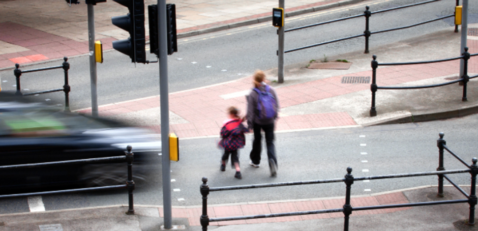 Image of pedestrians almost being hit by a car on a near miss